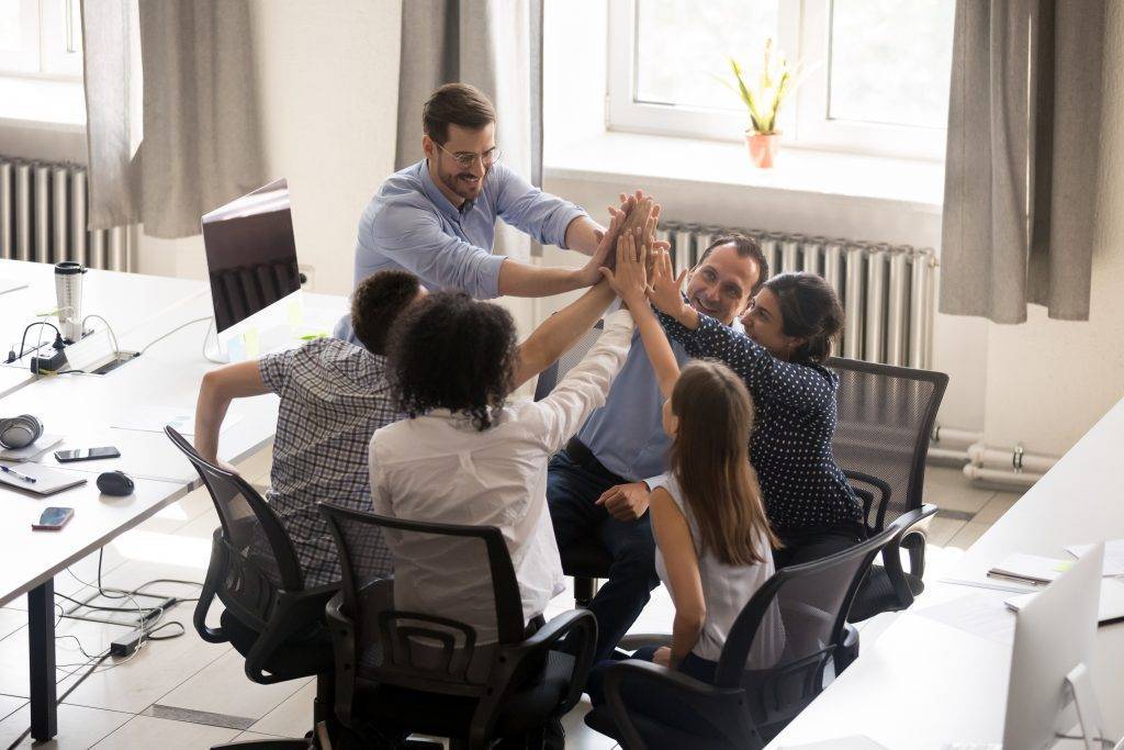 Multiracial,Employees,Team,With,Male,Leader,,Coach,Giving,High,Five